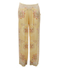 Flowy trousers with a honey yellow floral print
