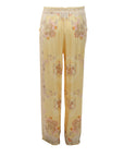 Flowy trousers with a honey yellow floral print