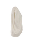 Gilet écru orné de boutons décoratifs dorés
