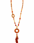 Collier extra long médaillon anneau et pompon brique
