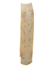 Flowy trousers with a honey yellow floral print